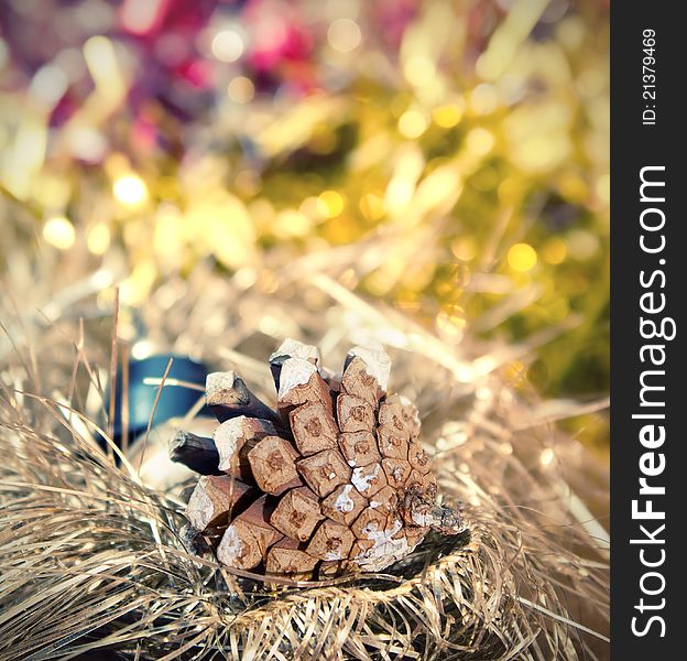 Christmas border with bauble and pine cones