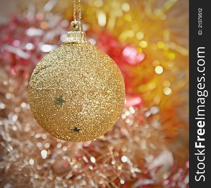 Yellow Christmas tree decorations on lights background
