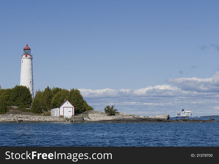 Lighthouse And Ferry