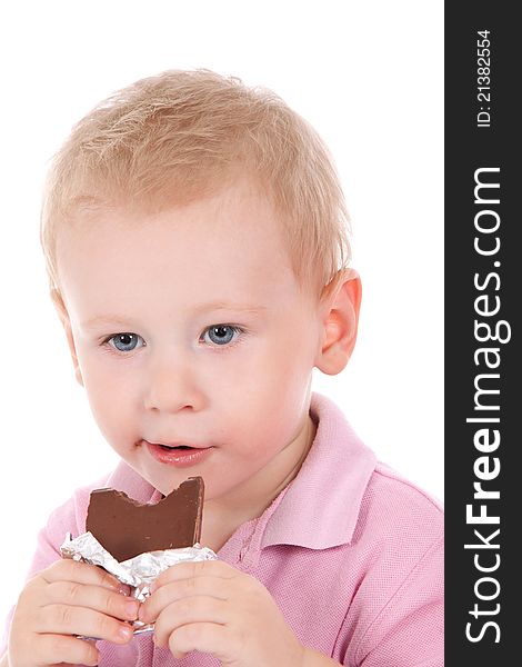 Little boy holding chocolate bar over white background