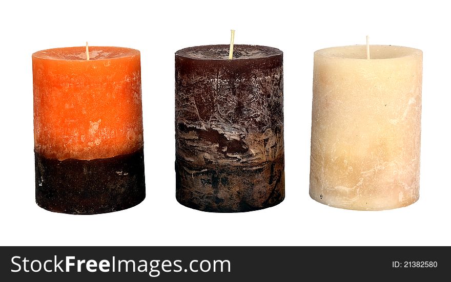 Three Christmas candles isolated on white