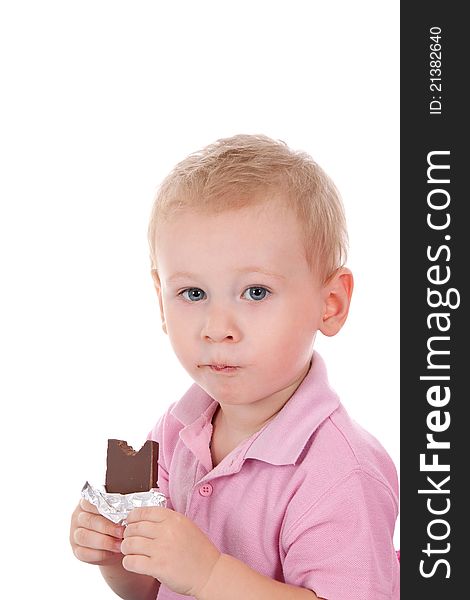 Little boy holding chocolate bar over white background