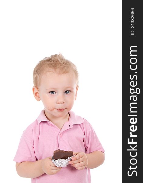 Little boy holding chocolate bar over white background