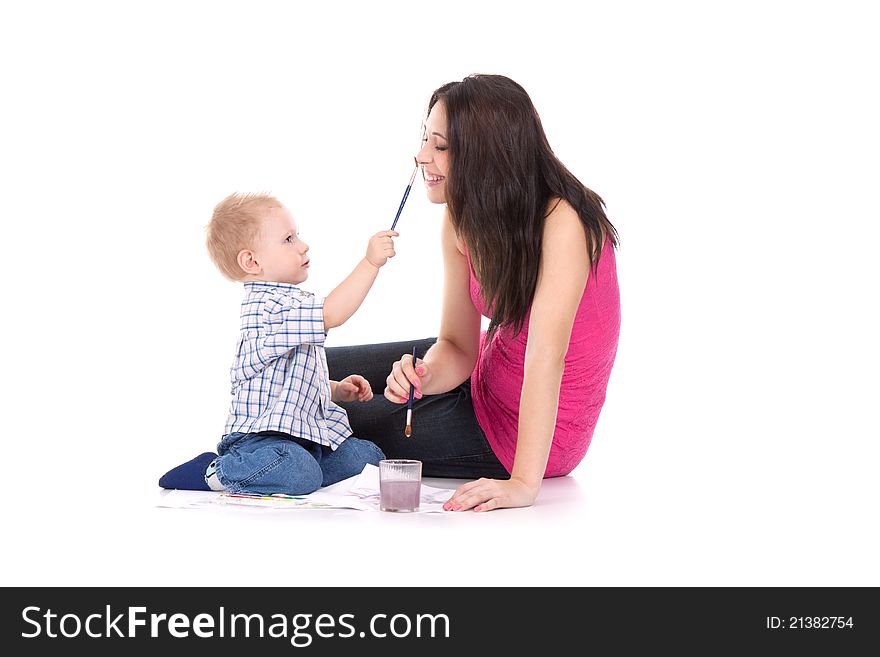 Child paint on mother face isolated over white background. Child paint on mother face isolated over white background