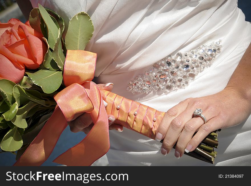Artistic closeup of bride holding her bouquet. Artistic closeup of bride holding her bouquet