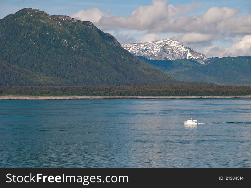 Sailing boat with mountains