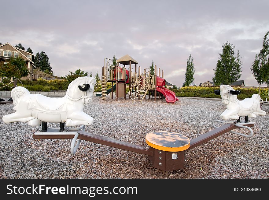 Neighborhood Public Park Children's Playground in Suburban Area with Seesaw