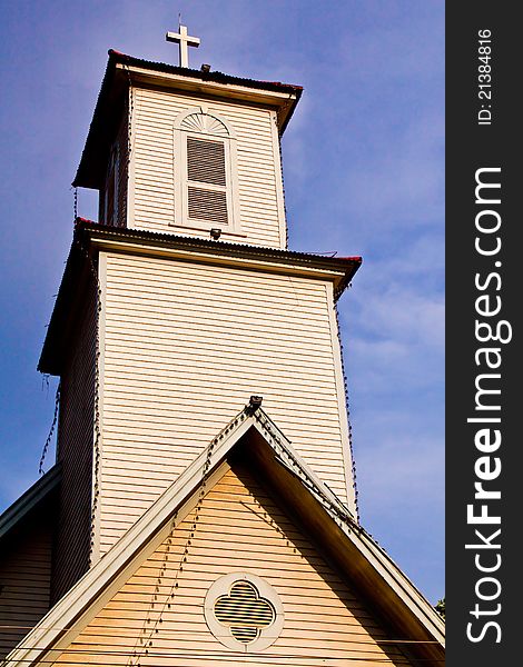 Cross silhouette against blue sky. Cross silhouette against blue sky