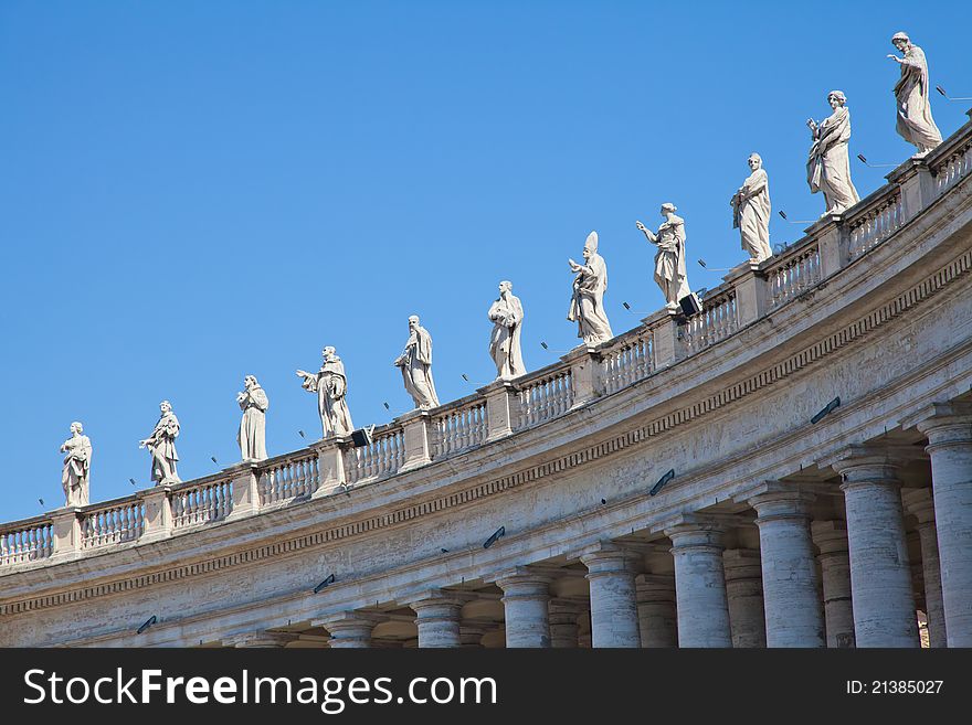 Statues in St. Peter Square (Rome, Italy) with blue sky background. Statues in St. Peter Square (Rome, Italy) with blue sky background