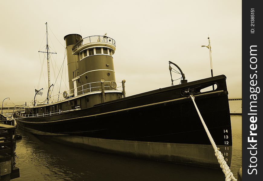 Picture of the old boat at pier_sepia