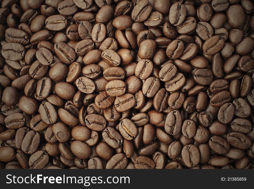 Roasted brown coffee, background texture, close-up