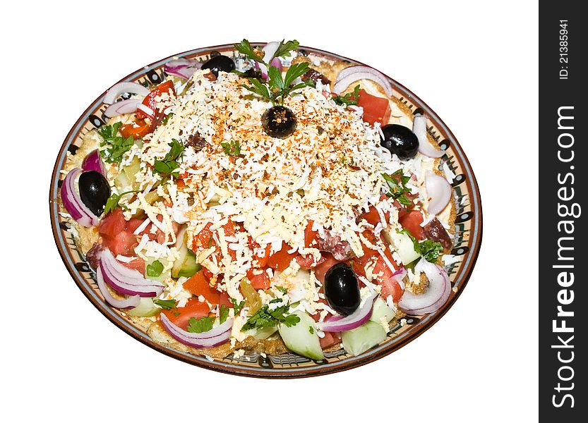 Salad of cucumbers and tomatoes, onions and olives topped with cheese