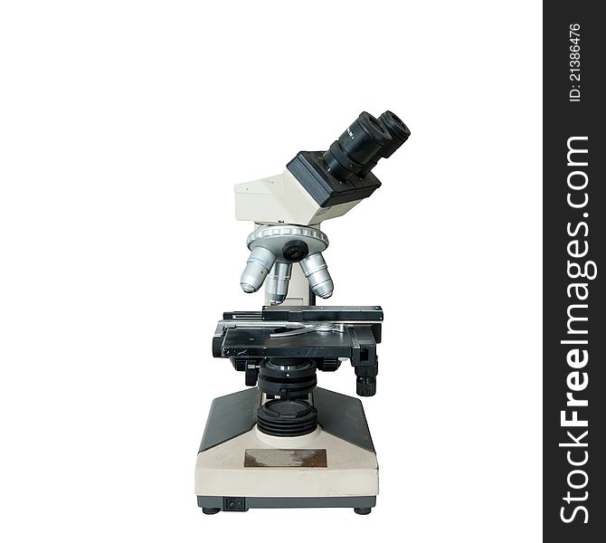 An Old-fashioned Microscope Isolated Over White