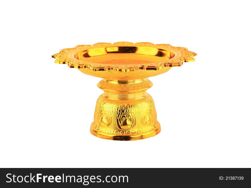 Direct view of a golden tray with pedestal on isolated white background