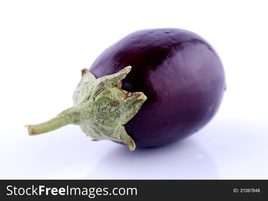 Photo of eggplants on a white background, soft focus
