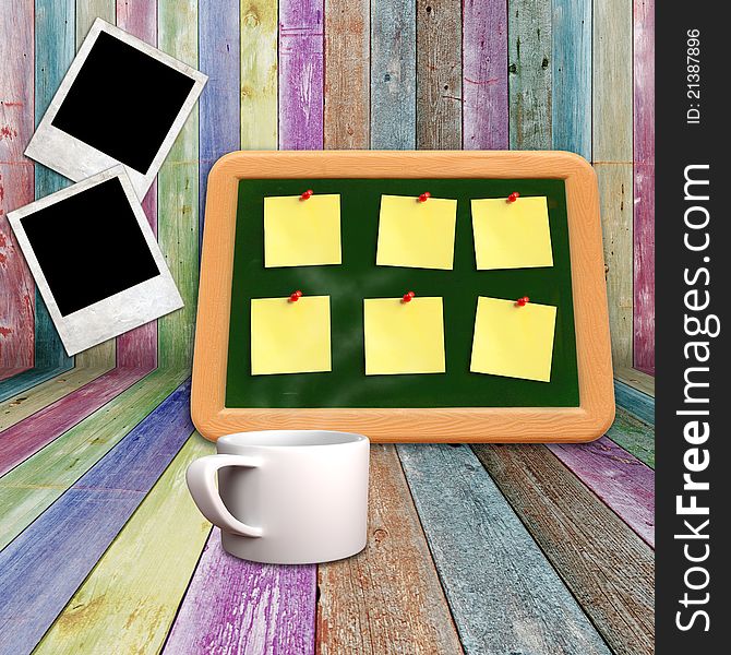 Blackboard and coffee mug on a vivid wooden shelves