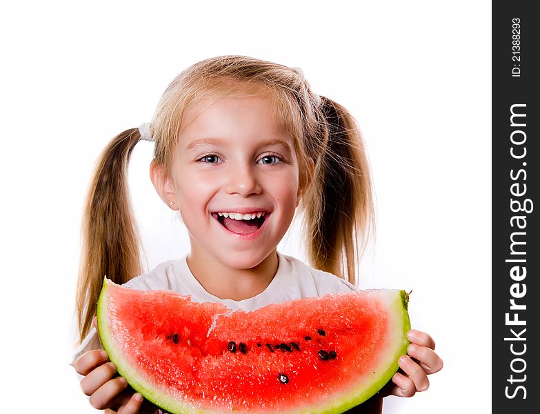 Little girl eating big piece of watermelon