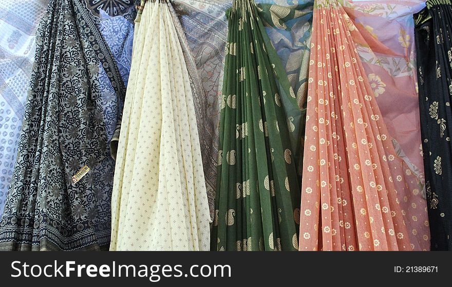 Asian sarees on market stall for sale