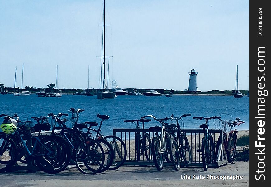 Bicycles, best source of travel on Martha`s Vineyard, bicycle.. rent or own, view of lighthouse from the ferry parking lot. beautiful blue water, ocean, sand, beach, good food, good fun, laughs, relax, unwind, meditate, just not on bike. Bicycles, best source of travel on Martha`s Vineyard, bicycle.. rent or own, view of lighthouse from the ferry parking lot. beautiful blue water, ocean, sand, beach, good food, good fun, laughs, relax, unwind, meditate, just not on bike