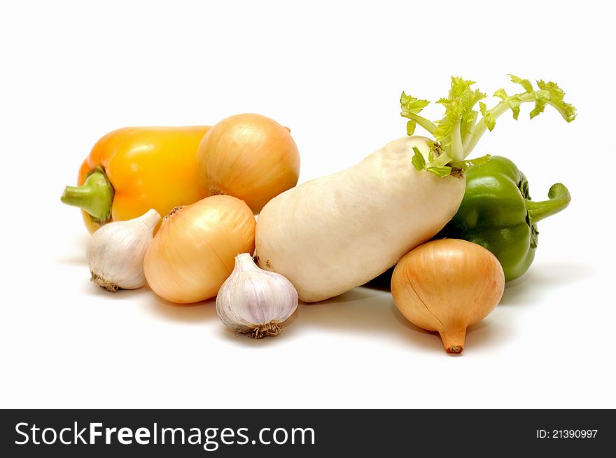 Onions, peppers, garlic and radish on white background. Onions, peppers, garlic and radish on white background
