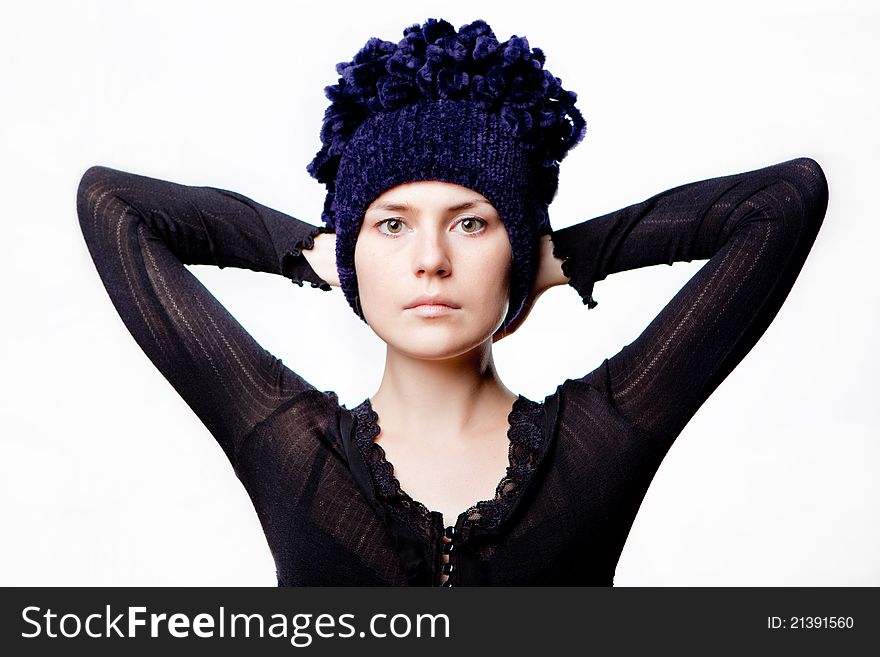 Beautiful woman in a blue hat