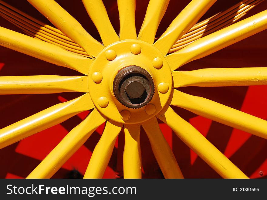 Red and yellow wagon wheel at a circus. Red and yellow wagon wheel at a circus