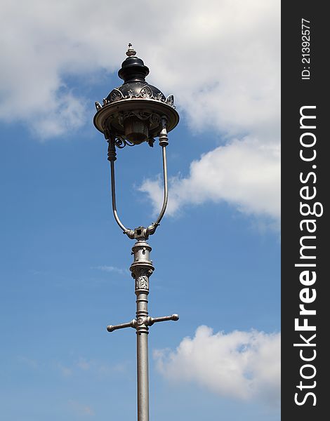 Old Style Lantern On Blue Sky Background