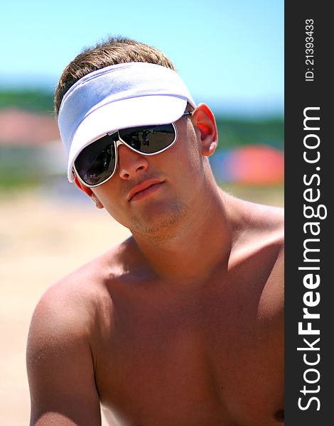 Attractive sports guy on the beach. Attractive sports guy on the beach