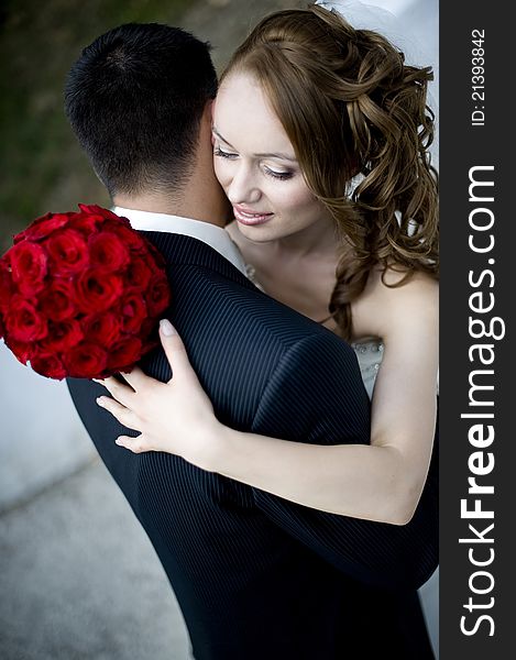 Close up portrait of a happy just married couple embracing each-other. Close up portrait of a happy just married couple embracing each-other