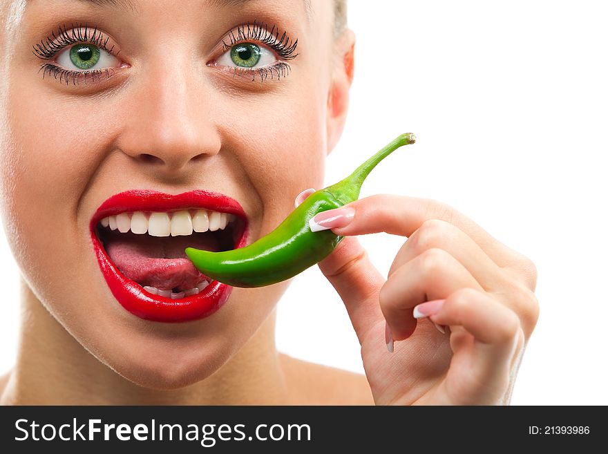 Beautiful woman with red lips eating green vegetable raw pepper. Beautiful woman with red lips eating green vegetable raw pepper