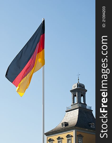 German flag on blue sky and university of Bonn background, photo taken on 1 of October 2011. German flag on blue sky and university of Bonn background, photo taken on 1 of October 2011