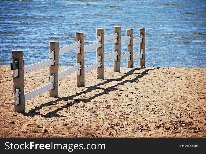 Wooden fence on deserted beach. Wooden fence on deserted beach