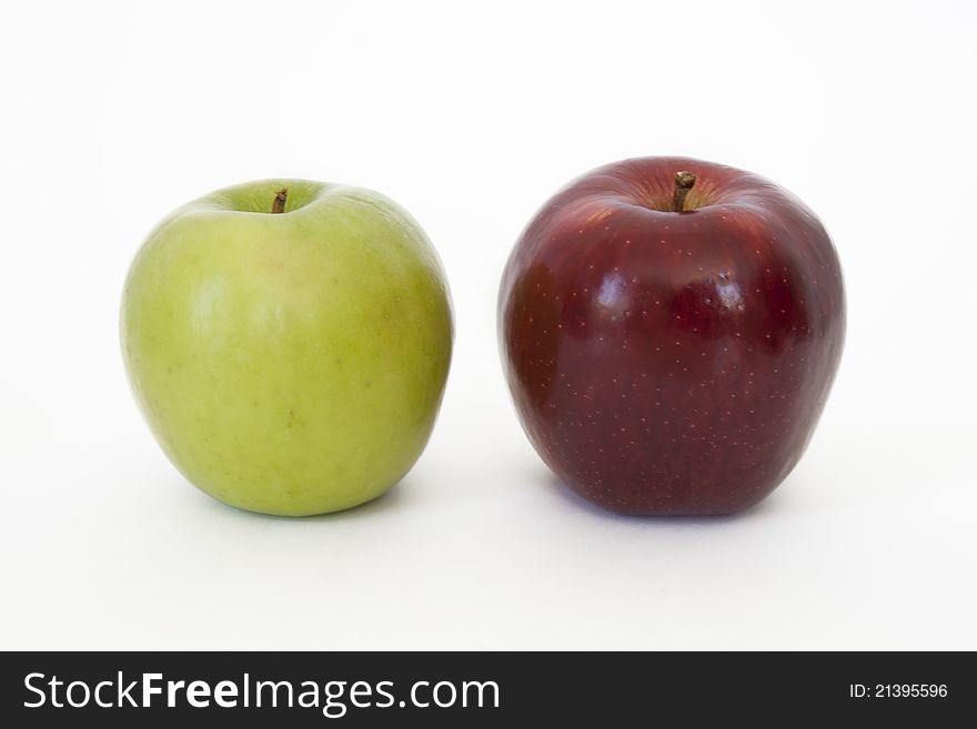 Green and red apples on white background