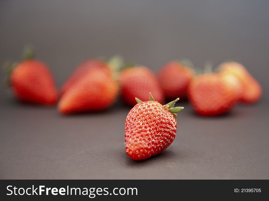 Group of fresh red strawberry isolated on black background