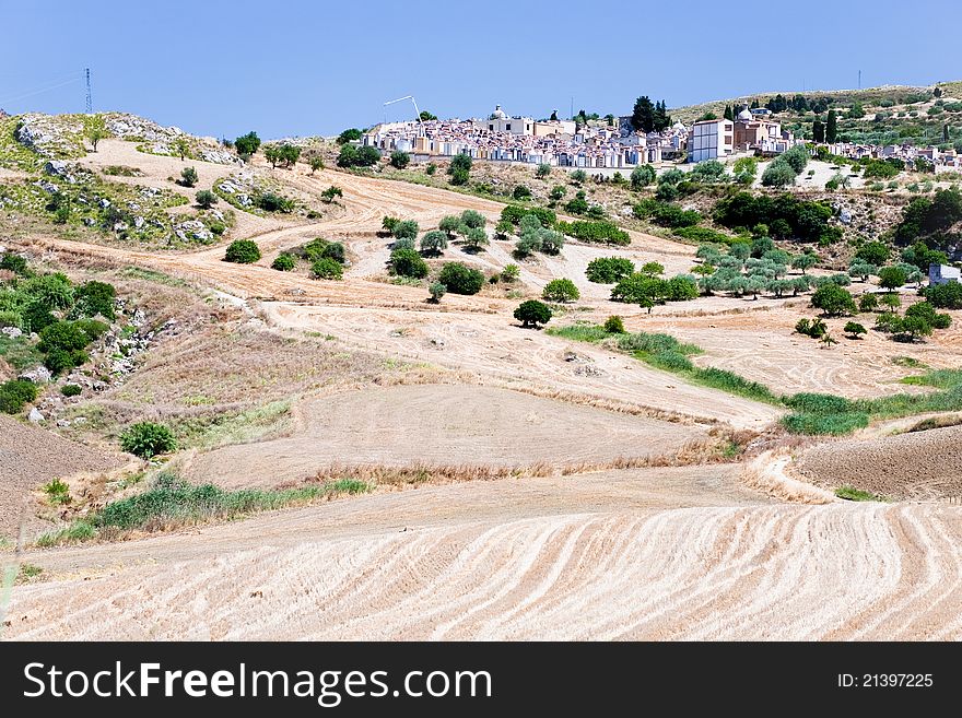 Agricultural fields and old catholic cemetery in Sicily