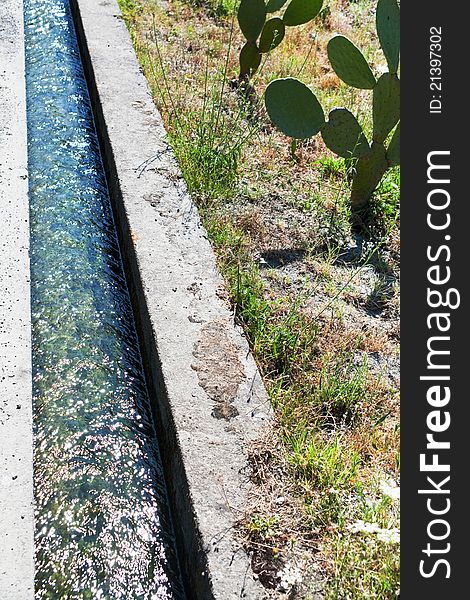 Irrigation ditch in Sicily in summer day