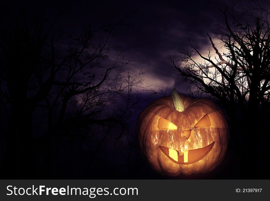 Scary pumpkin and forest at halloween night