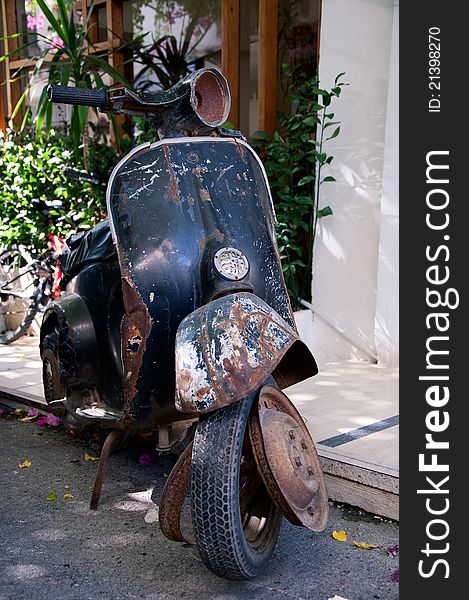 Very old vintage, forgotten, broken bike near the house. Very old vintage, forgotten, broken bike near the house