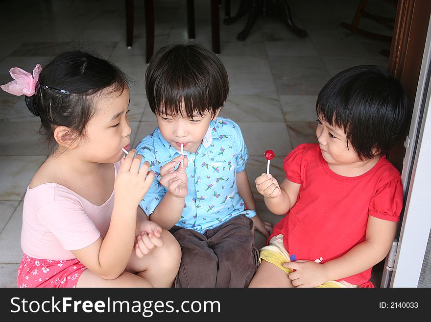 Kids Eating Lollipop