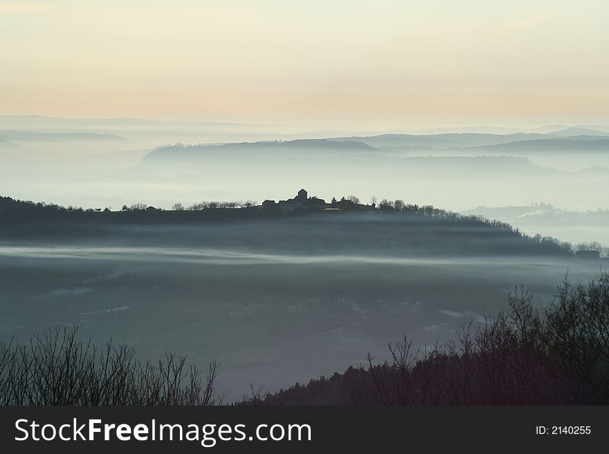 Streak of mist through village