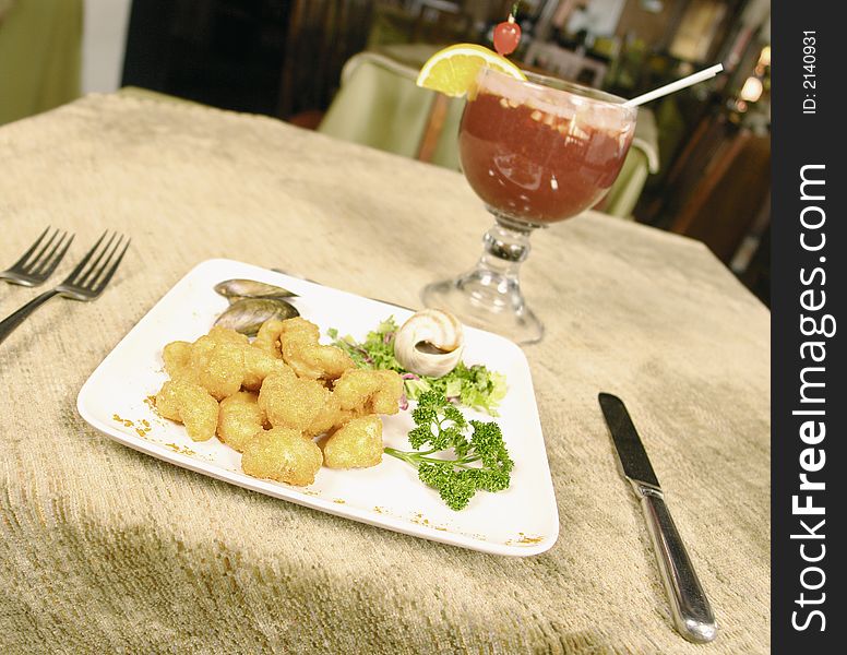 Deep fried shrimps served with a cocktail