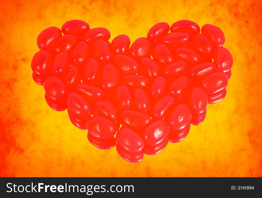 Jellybean heart on a vibrant orange lightly textured background