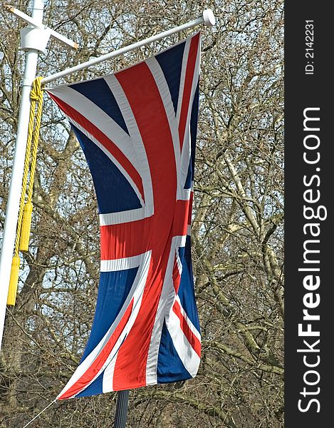 The Union Jack flapping in the breeze along the Mall, London, England.