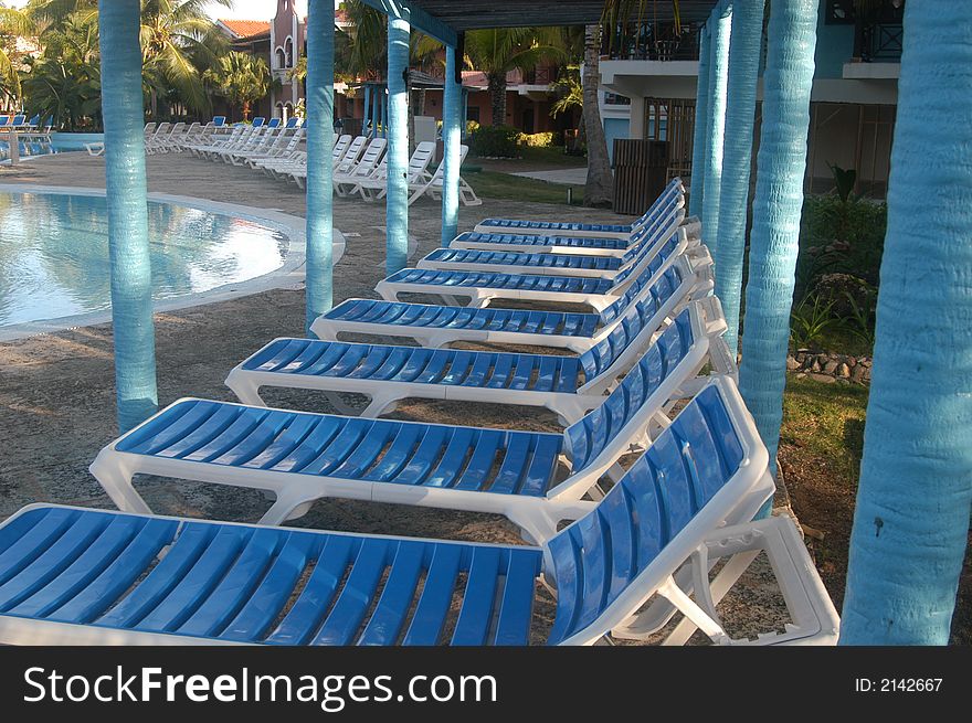 Blue and white swimming pool chairs. Blue and white swimming pool chairs