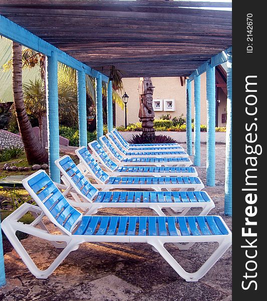 Blue and white swimming pool chairs. Blue and white swimming pool chairs