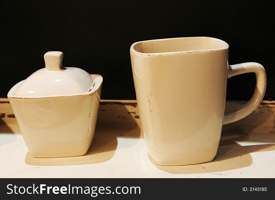 White pottery cup and sugar bowl - home interiors
