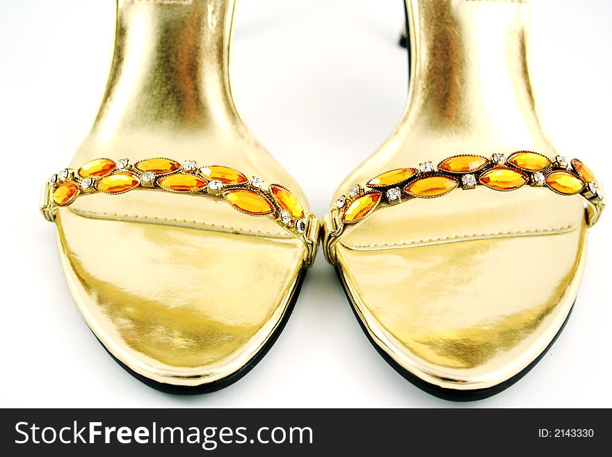 Sexy gold shoes on white. Sexy gold shoes on white