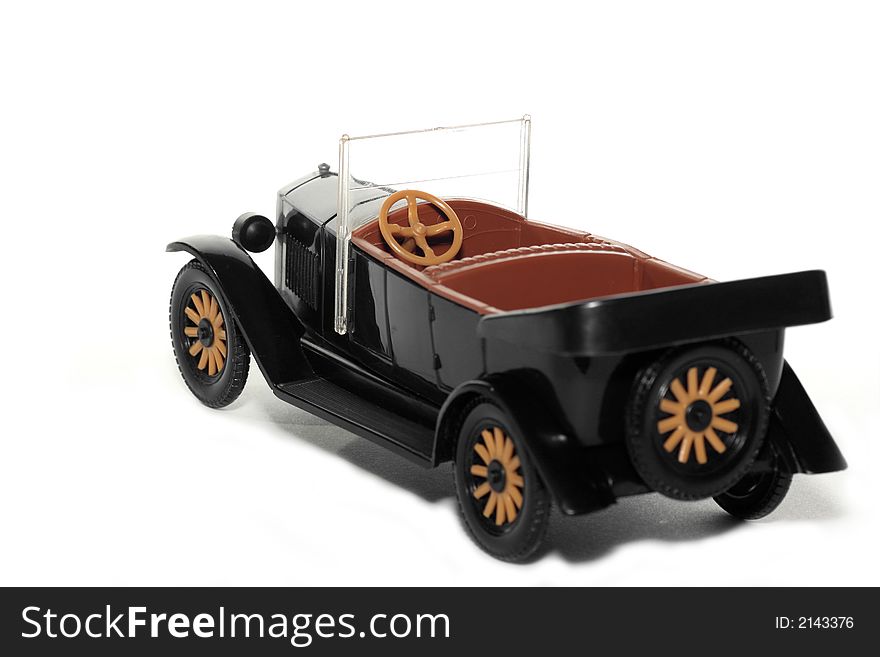 Picture of a old plastic toy car Volvo Jakob 1927. Czech toy from my brothers toy collection. Made in the 1970's. Isolated on real white. Picture of a old plastic toy car Volvo Jakob 1927. Czech toy from my brothers toy collection. Made in the 1970's. Isolated on real white.