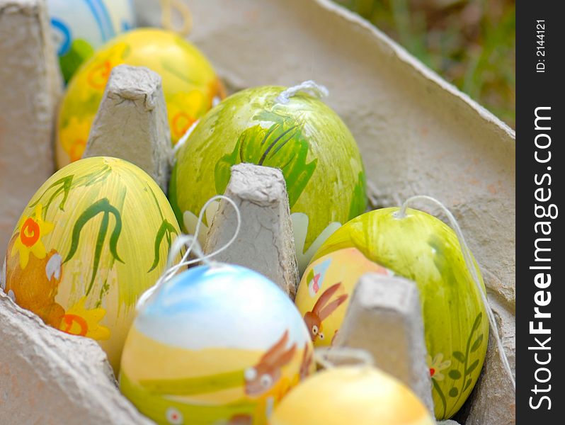 Colored and decorated Easter eggs in cardboard egg carton. Colored and decorated Easter eggs in cardboard egg carton.