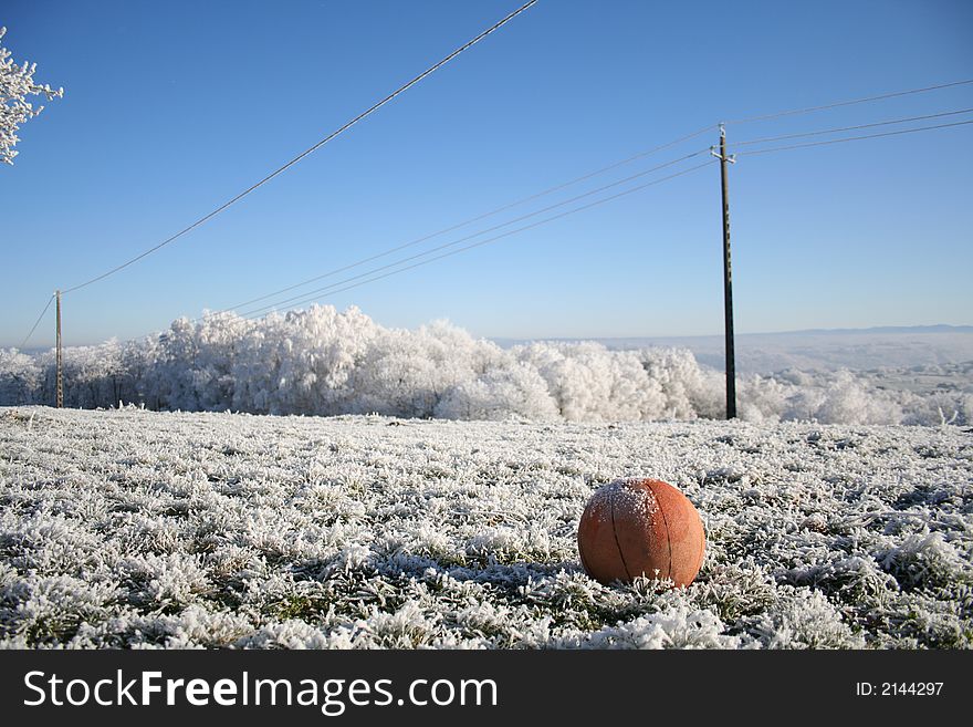 Basket ball in wintery field. Basket ball in wintery field